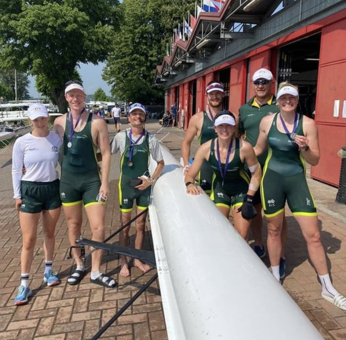 members of the rowing team with medals 