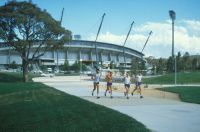 Robert de Castella 1982 Athletics training group outside outdoor stadium