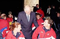 Prime Minister John Howard chatting with the AIS Commonwealth Games team at a farewell breakfast 2002