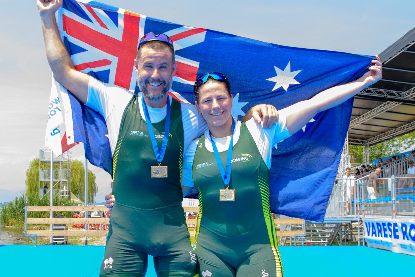 Nikki Ayers and teammate Jed Altschwager holding up the Australian flag