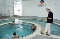 Dr. David Martin physiologist, timing the amount of time spent in the plunge pool by the athletes 2007