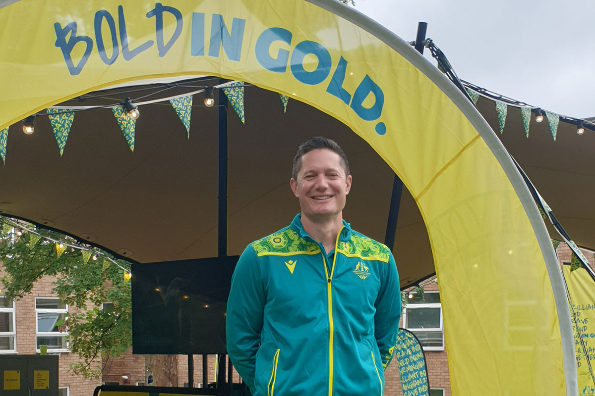 AIS Clinician and Mental Health Manager with the AIS Mental Health Referral Network Matt Butterworth stands at the Birmingham Games. .