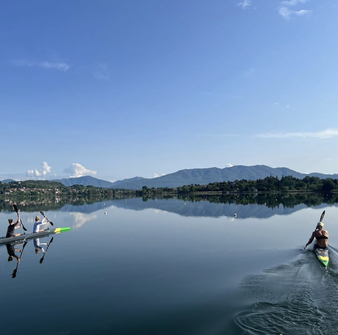 Athletes rowing in the morning on the lake