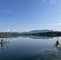 Athletes rowing in the morning on the lake