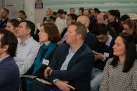People seated, listening to a guest speaker