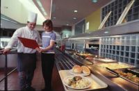 Nikki Cummings and chef at the AIS dining hall 1999