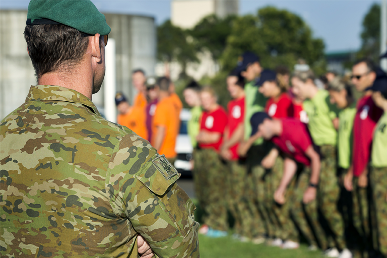 Australian Army soldier puts athletes and coaches through a training session.