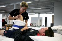 Physical therapies physiotherapist Ebonie Scase treating AIS athlete Heath Francis 2009 