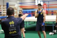 Boxing coach Don Abnett demonstrating punch technique AIS sports draft athletes 2014