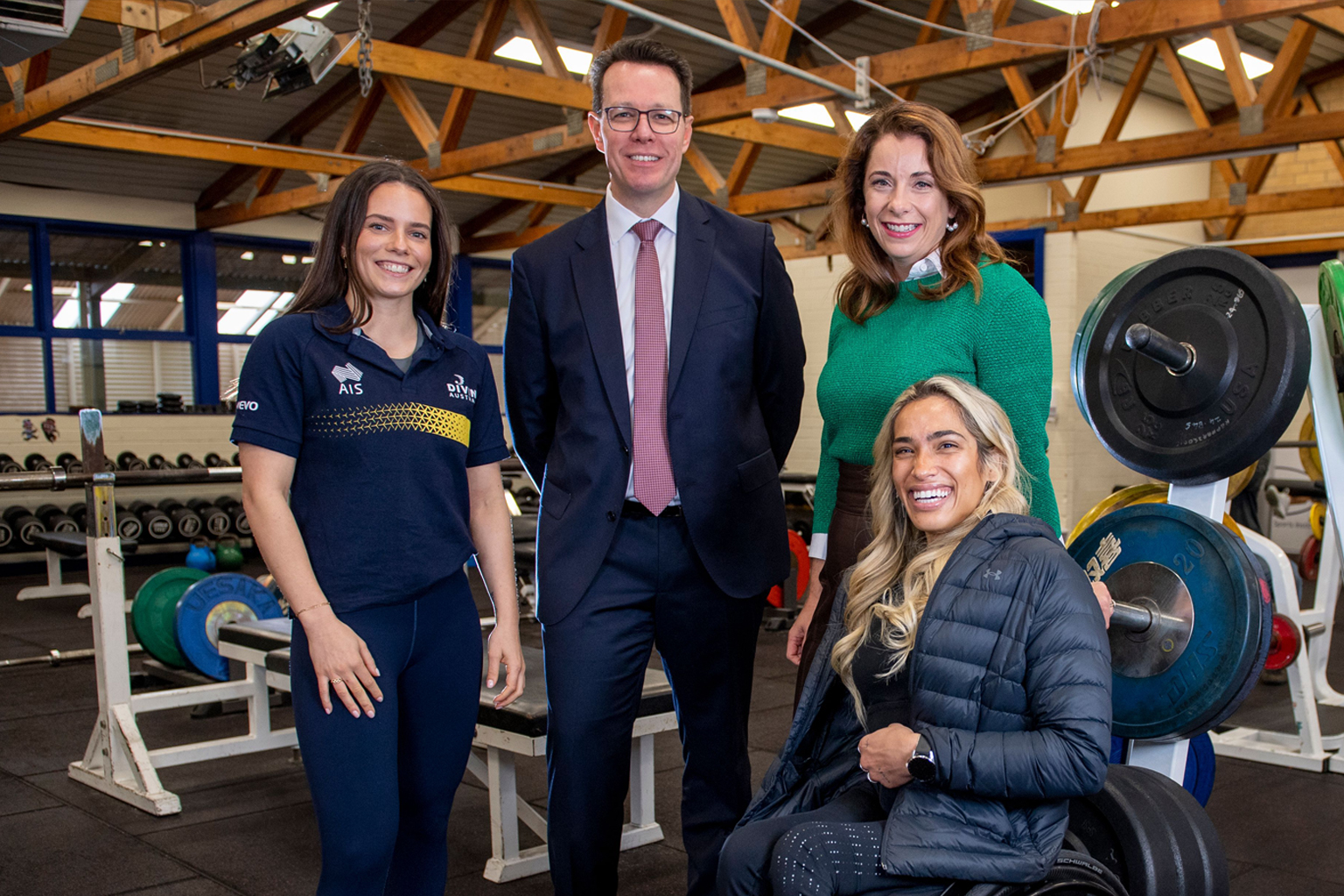 Anabelle Smith, Kieren Perkins, Anika Wells and Madison De Rozario gathered in a gym