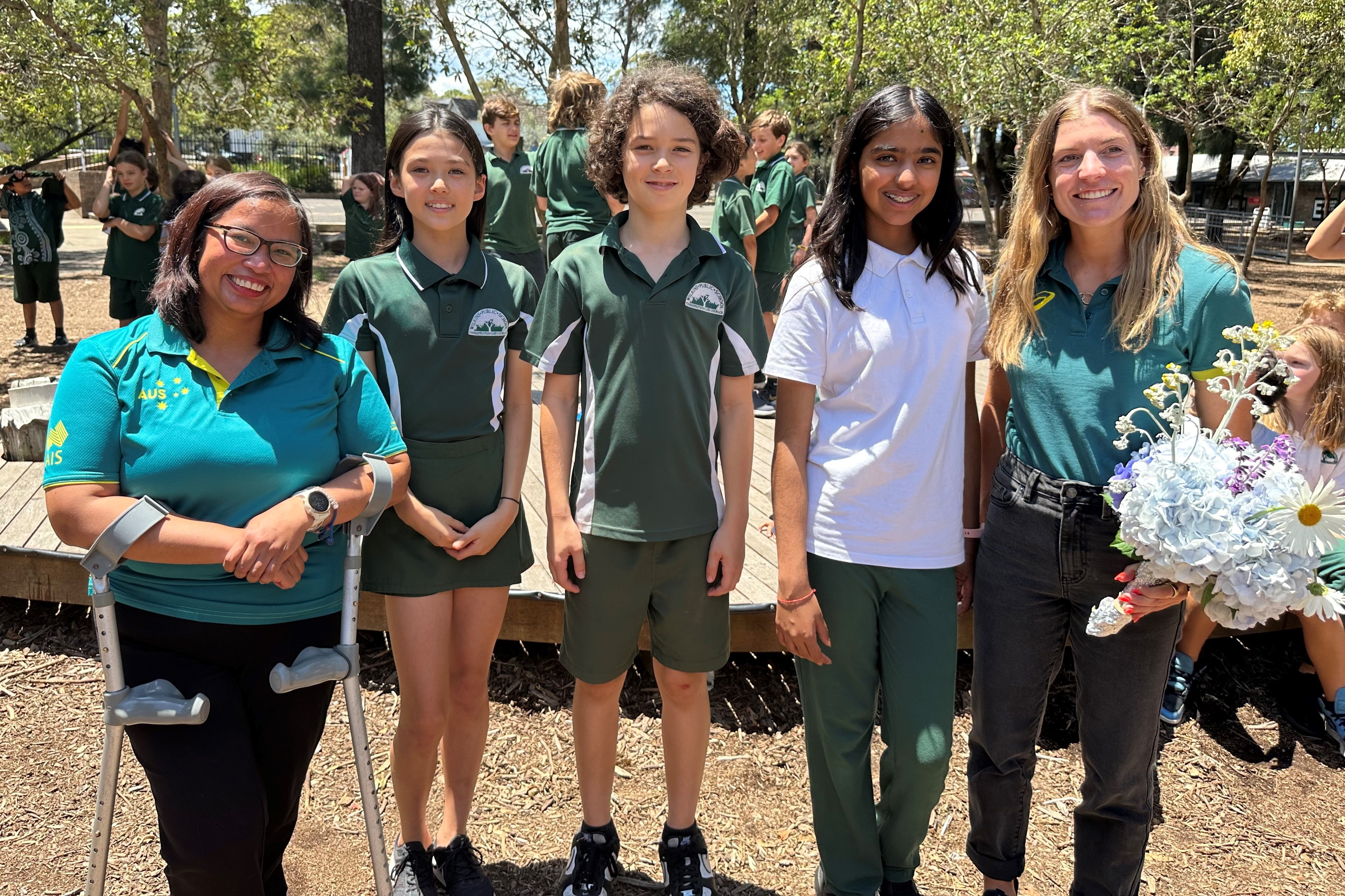 Himbury and Oktrininda with three Wilkins primary students.