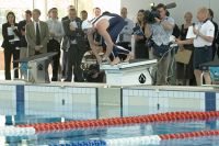 Opening of the Swimming Centre and Administration building - AIS athlete Kirk Palmer prepares to dive into the pool on the force measuring start block, while Bruce Mason Head of Aquatics Testing Training and Research conducts performance analysis testing 2006