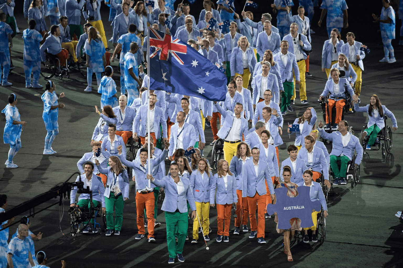 Flag bearer Bradley Ness leads members of the Australian Paralympic Team into the 2016 Rio Games opening ceremony. 
