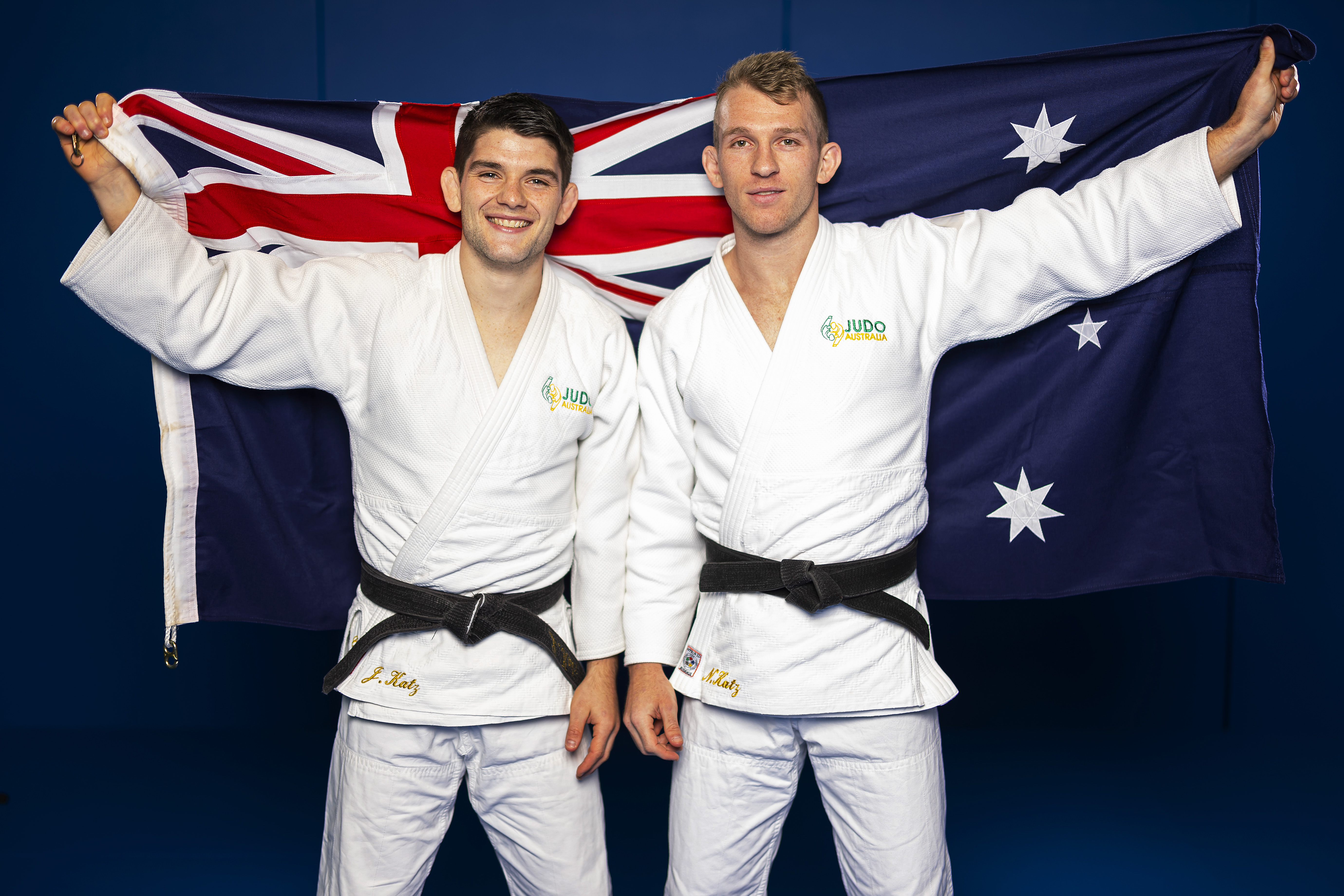 The Katz brothers hold Australian flag.