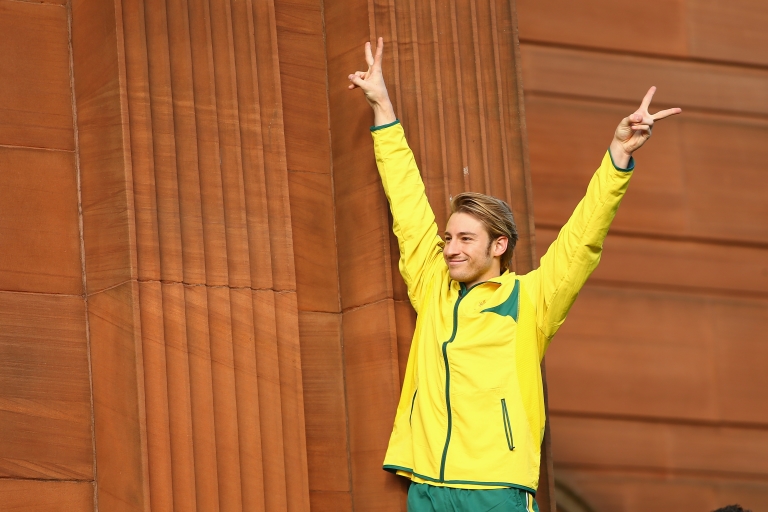 Matthew Mitcham gives the peace sign.
